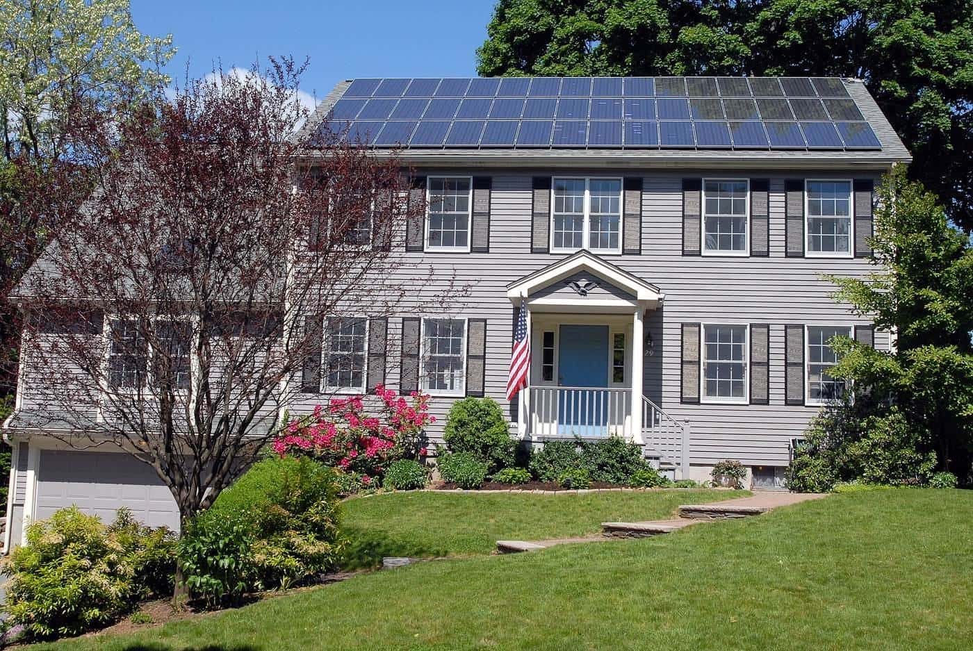 Solar panels across the roof of a two-storey house